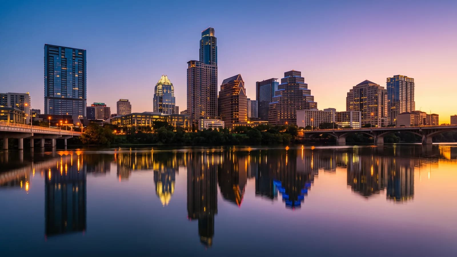 Downtown Austin, Texas skyline at dusk reflected in the Colorado River